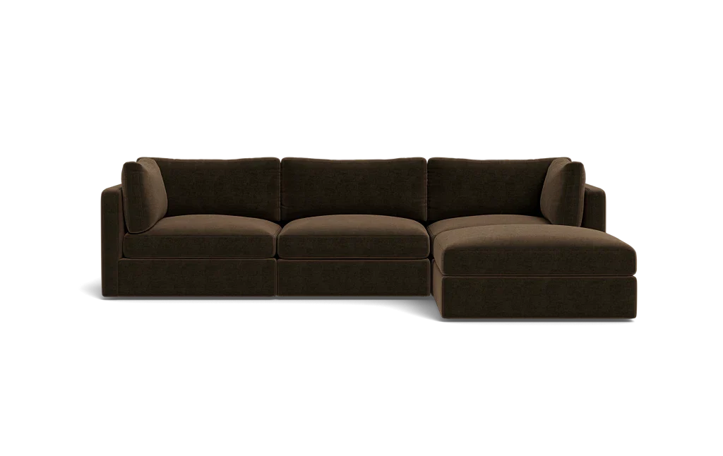 The Tatum Modular 3 Seat Chaise 106" Sectional is a dark brown piece featuring three seat cushions and a chaise lounge on the right. It boasts clean lines and a plush appearance, set against a plain black background.