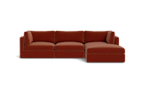 A contemporary Tatum Modular 3 Seat Chaise 106" Sectional showcasing clean lines, adorned with deep orange cushions, set against a simple black backdrop, and offering plush seating.