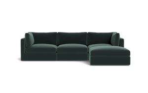 The Tatum Modular 3 Seat Chaise 106" Sectional is a dark green sofa with three seat cushions, a chaise on the right side, three back cushions, and two armrests against a solid black background.
