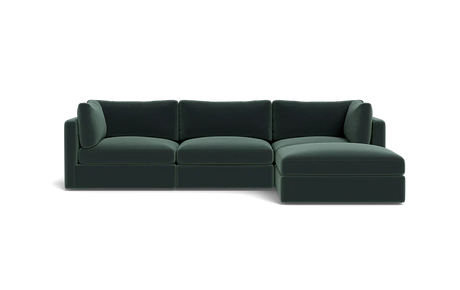 The Tatum Modular 3 Seat Chaise 106" Sectional is a dark green sofa with three seat cushions, a chaise on the right side, three back cushions, and two armrests against a solid black background.