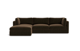 The Tatum Modular 3 Seat Chaise Sectional, featuring a large, dark brown design with cushioned seats and backrests, is displayed against a solid black background. It includes a chaise lounge on the left side, offering ample seating space.