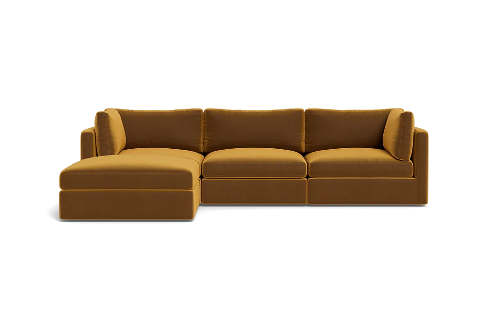 A Tatum Modular 3 Seat Chaise Sectional in mustard yellow, showcasing clean lines and plush cushions against a plain black background, features a left-side chaise for a sleek and modern design.