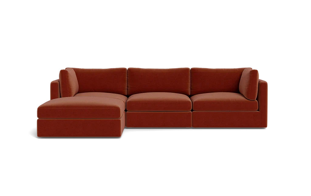 Introducing the Tatum Modular 3 Seat Chaise Sectional, a contemporary red-brown sofa with clean lines and a minimalist design, set against a solid black background. This sectional features a left-side chaise for an extended seating area.