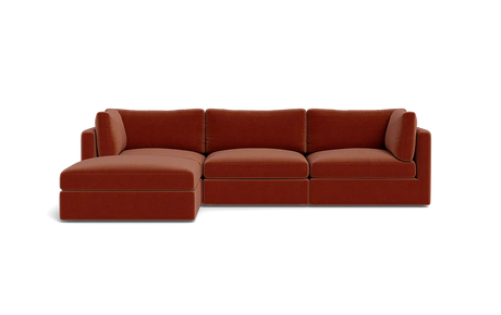 Introducing the Tatum Modular 3 Seat Chaise Sectional, a contemporary red-brown sofa with clean lines and a minimalist design, set against a solid black background. This sectional features a left-side chaise for an extended seating area.