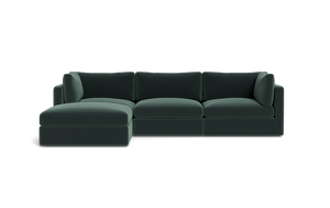 The Tatum Modular 3 Seat Chaise Sectional, featuring sleek cushions and a left-sided chaise in dark green, is set against a plain black background.