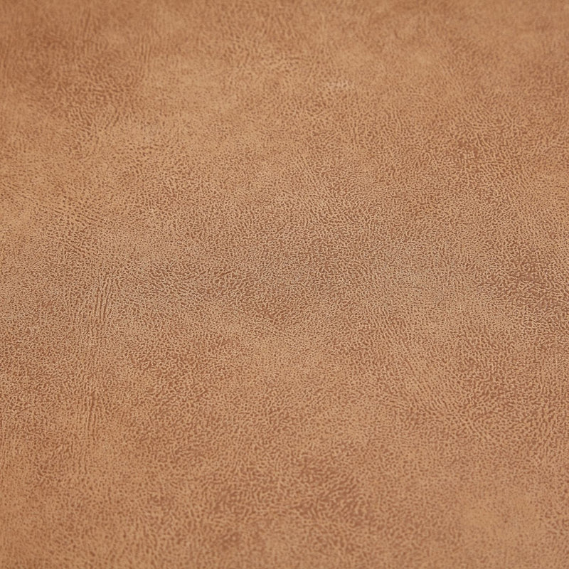 Close-up of a textured brown surface from The 5th Open 116" Left Facing Sectional. The material features a subtle, intricate pattern with small, irregular dots and lines, creating a natural, grainy appearance.