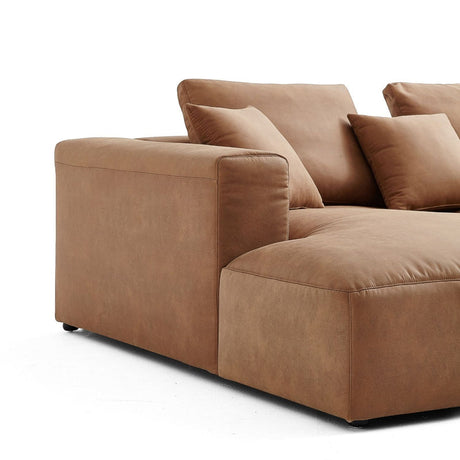 The 5th Open 116" Left Facing Sectional is a spacious and contemporary brown sectional sofa featuring plush cushions set against a white backdrop. It boasts soft, wide armrests and a sleek, minimalist design, ensuring excellent seating comfort.