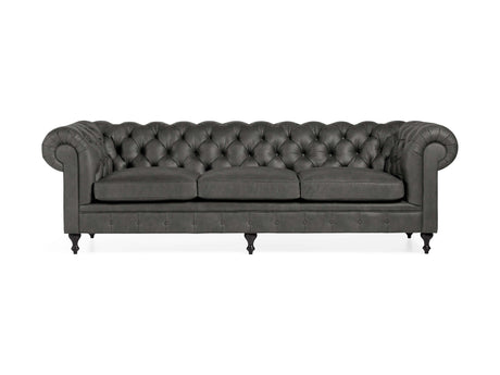 Introducing the Wessex Leather Sofa: a sophisticated Chesterfield sofa in dark gray, boasting three seat cushions and exquisitely tufted backrest. The design is accented by rolled arms, dark turned wooden legs, and an elegant classic style.