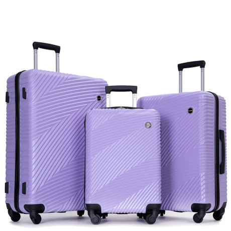 The 3 Piece Luggage Set features lavender suitcases with ribbed diagonal patterns, black retractable handles, and black spinner wheels. The set includes three sizes: small at the front and larger ones positioned slightly behind, each designed for lightweight travel.