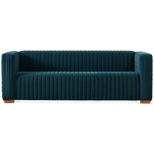 The Elara Upholstered Sofa features a contemporary teal velvet design with vertical channel tufting and square arms, complemented by a sleek profile and wooden block legs.