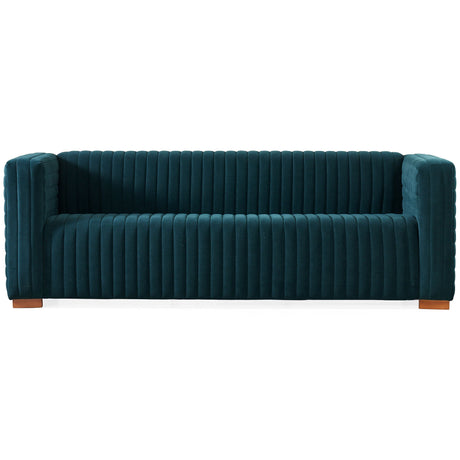 The Elara Upholstered Sofa features a contemporary teal velvet design with vertical channel tufting and square arms, complemented by a sleek profile and wooden block legs.