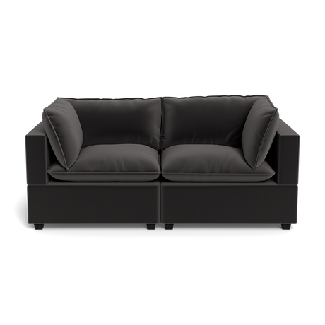 The Kova Pillow Cushion Sofa 86" is a modern black two-seater with thick cushions and large square armrests, shown from the front against a plain black background.