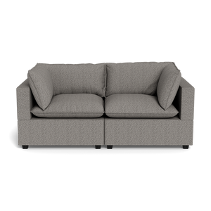 The Kova Pillow Cushion Sofa 86" is a modern gray upholstered sofa featuring two seat cushions and two large matching backrest pillows, displayed against a black background.