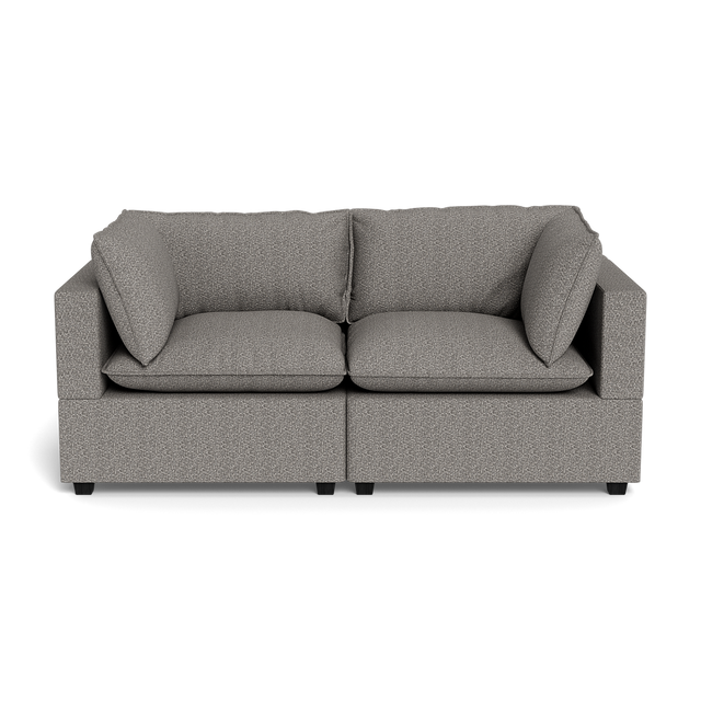 The Kova Pillow Cushion Sofa 86" is a modern gray upholstered sofa featuring two seat cushions and two large matching backrest pillows, displayed against a black background.