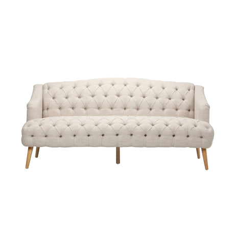 The Comfy 3 Seat Sofa features a beige, tufted design with wooden legs, three cushions, and a curved backrest. Its classic button-tufting across the seat and back adds an elegant touch to any living room or study.
