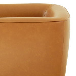 Close-up of a corner of the tan Callan Swivel Chair, highlighting its soft, smooth texture, and curved design. A visible seam emphasizes the quality craftsmanship. The background remains plain white.