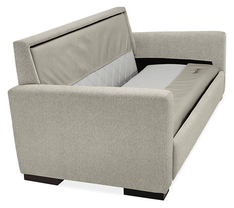 The Berin Day & Night Sleeper Sofa is a contemporary gray piece featuring sleek, angular arms and prominently displayed cushioning. The sofa includes a backrest adorned with patterned fabric and stands on dark wooden legs.