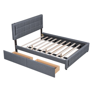 The Upholstered Platform Bed With Trundle & Drawers features a gray tufted headboard. It comes disassembled, displaying its wooden slats and two storage drawers at the foot of the bed.