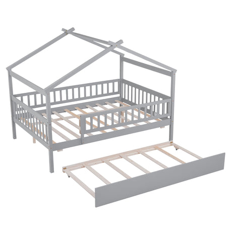 The Creativity House Bed features a gray, house-shaped twin frame with slatted railings and a roof-like top. It includes an unassembled wooden pull-out trundle beneath, all displayed on a white background.