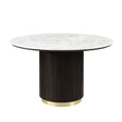 The Clayten Around Dining Table features a white marble top and a cylindrical ribbed espresso base with a golden accent, offering a modern and elegant design.