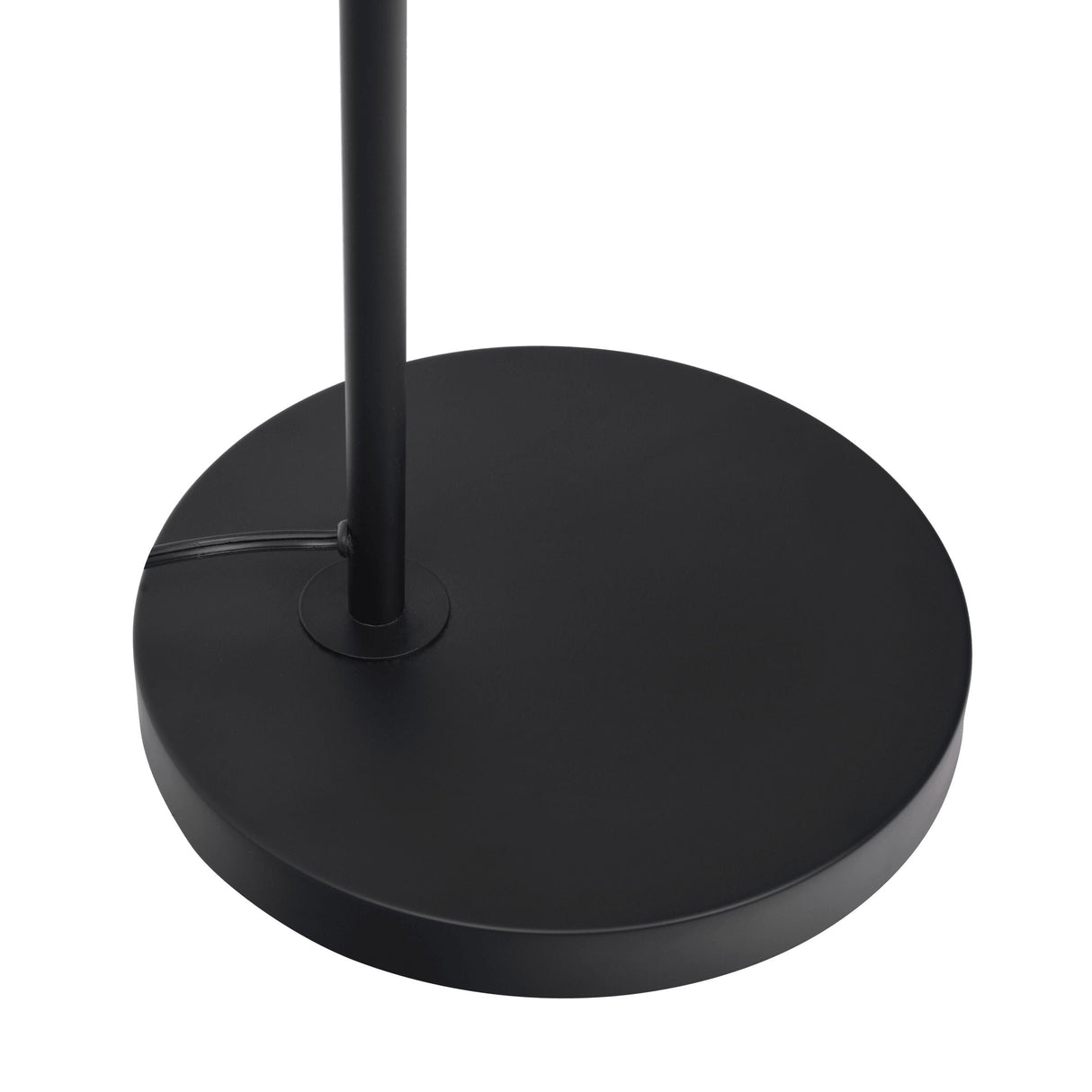 The Seoul Floor Lamp features a black, round, flat base with an attached vertical pole at the center. The power cord extends from the left side, and the lamp is set against a plain white background.