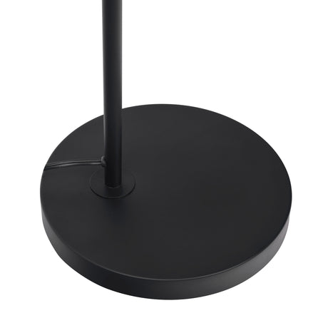 The Seoul Floor Lamp features a black, round, flat base with an attached vertical pole at the center. The power cord extends from the left side, and the lamp is set against a plain white background.