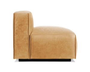 A side view of the Cleon Modern Unarmed Sofa, featuring a minimalist design in tan leather. This sleek piece has a cushioned seat and backrest, supported by a black base. Its contemporary style is evident through its clean lines and smooth texture.