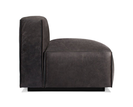 A side view of the Cleon Modern Unarmed Sofa reveals its dark grey, plush leather upholstery on a black base. The design features sleek lines with a minimalist style, highlighting its comfortable padded seat and backrest.