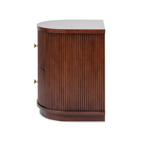 A side view of the Valentine - 2 Drawer Storage Side Table shows a wooden cabinet with a semi-circular front, vertical ridged detailing, two brass side handles, and a flat top with a rich dark wood finish.