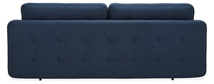 Rear perspective of the Deco Convertible Sleeper Sofa, showcasing its modern, tufted design in a dark blue hue. This sofa boasts a sleek and minimalist form with two cushions lining the top and petite legs for an elegant appearance.