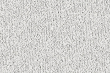 Close-up of the Dori Sofa by Acanva, showcasing its textured white fabric, featuring a rough, irregular pattern with small shadows creating a dappled effect. The surface appears slightly grainy, giving it a tactile, rustic appearance.