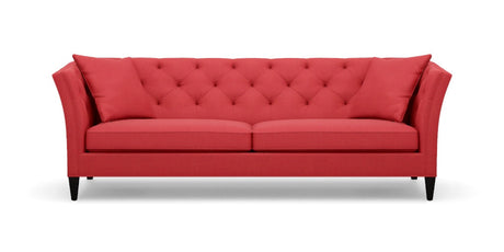 The Shelton 98" Sofa features a red color with a tufted backrest and two seat cushions, along with stylish flare arms. It rests on dark wooden legs and embodies a modern, elegant design.