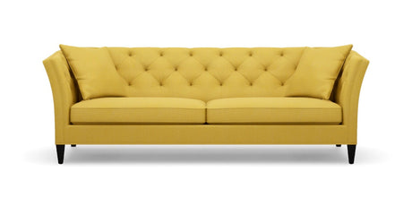 The Shelton 98" Sofa, with its bright yellow upholstery, button-tufted backrest and cushions, sloped arms, and black legs, is set against a plain white background.