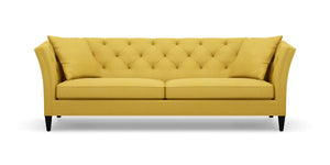 The Shelton 98" Sofa, with its bright yellow upholstery, button-tufted backrest and cushions, sloped arms, and black legs, is set against a plain white background.