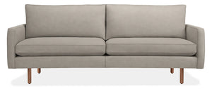 Introducing the 86" Jasper Sofa, a modern piece in light gray, featuring two seat cushions and two back cushions. It boasts slim armrests and stands on four wooden legs, embodying a minimalist and contemporary design.