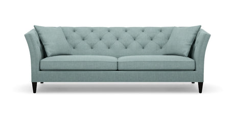 The Shelton 98" Sofa is teal with a tufted backrest and angled arms, featuring two seat cushions and four tapered black legs.