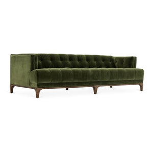 The Caledonia Sofa in Sapphire Olive Velvet features a tufted design with wooden legs, complemented by a low backrest and armrests. Its modern and elegant appearance makes it ideal for a contemporary living room.