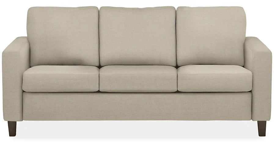 The Berin Day & Night Sleeper Sofa is a modern, beige three-seater designed with plush cushions and straight armrests. It sits on short, dark wooden legs, making it ideal for contemporary living room decor.