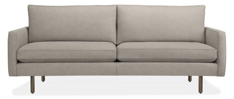 The 86" Jasper Sofa is a modern, light gray seating option with a clean and minimalist design. It features two seat cushions, two back cushions, and slim metal legs for support. With its sleek and contemporary appearance, it is well-suited for various living spaces.