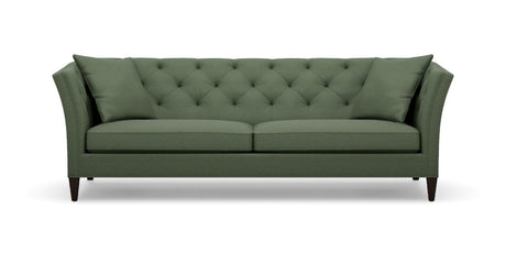 The Shelton 98" Sofa is a green, mid-century modern piece featuring a tufted backrest and angled arms. It includes two large cushions and rests on four dark wooden legs.