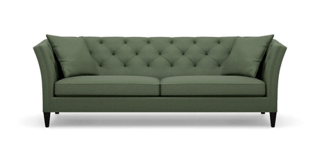 Introducing the Shelton 98" Sofa: a green tufted masterpiece accompanied by two matching cushions. This design boasts high arms and a sleek, modern aesthetic, complete with dark wooden legs and a cozy, plush appearance.