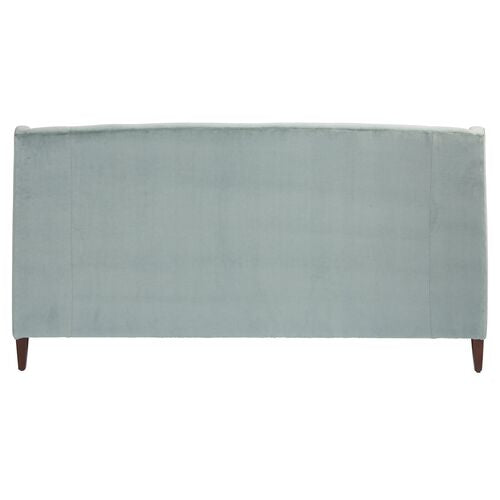 A Sage Velvet upholstered Dawes Sofa with wooden legs, featuring a rectangular shape and a smooth surface, seen from the back view.