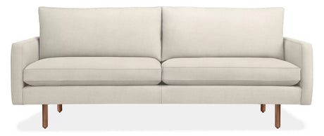 The 86" Jasper Sofa is a modern, minimalist piece featuring a beige color with a straight back and two seat cushions. It boasts sleek armrests and wooden legs, offering a contemporary look, all set against a plain white background.