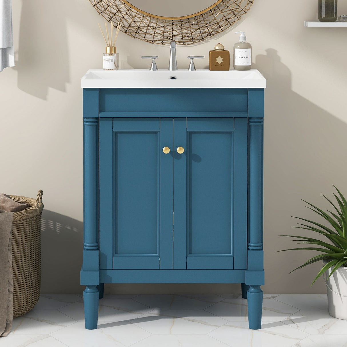 The Bathroom Vanity With Top Sink, 2-Tier Modern Bathroom Storage Cabinet in teal has gold knobs and a rectangular white sink with a silver faucet. Set against a light beige wall with a round wicker-framed mirror above, it sits on a marble floor next to a potted plant and wicker basket.