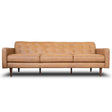The Braxton Sofa in tan is a mid-century modern piece featuring a button-tufted backrest, three seat cushions, straight armrests, and tapered wooden legs.