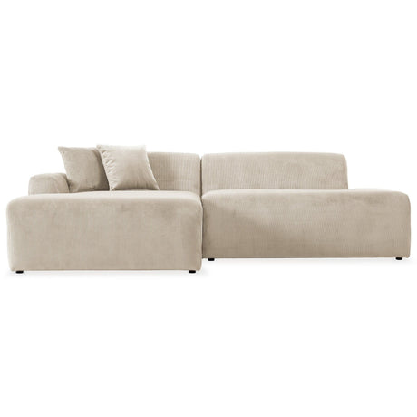 The Mar sectional sofa is a modern, light beige piece featuring a left chaise and two throw pillows, upholstered in soft textured fabric. With minimalist design, clean lines, and a low profile, it stands out beautifully against a white background.