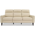 The Elliot - Incliner Sofa Left is a beige, three-seater with cushioned backrests and armrests. It features a smooth, leather-like texture and dark, tapered wooden legs against a simple light background.