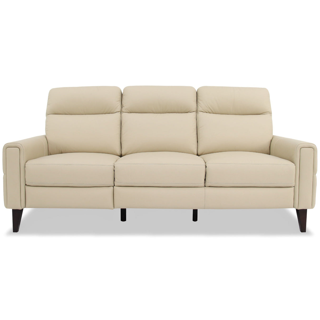 The Elliot - Incliner Sofa Left is a beige, three-seater with cushioned backrests and armrests. It features a smooth, leather-like texture and dark, tapered wooden legs against a simple light background.