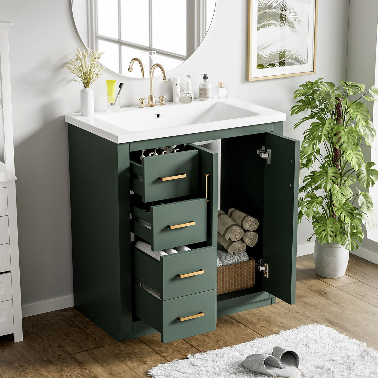 A modern bathroom vanity from the "Ceramic Sink Combo" collection features a freestanding design with a white countertop and green cabinets. The set includes open drawers with brass handles, showcasing towels and toiletries. A round mirror, potted plant, and window enhance the decor.