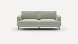 The Ember Mid-Century Modern 75" Sofa, featuring a light gray design with clean lines and wooden legs, is showcased against a plain white background.